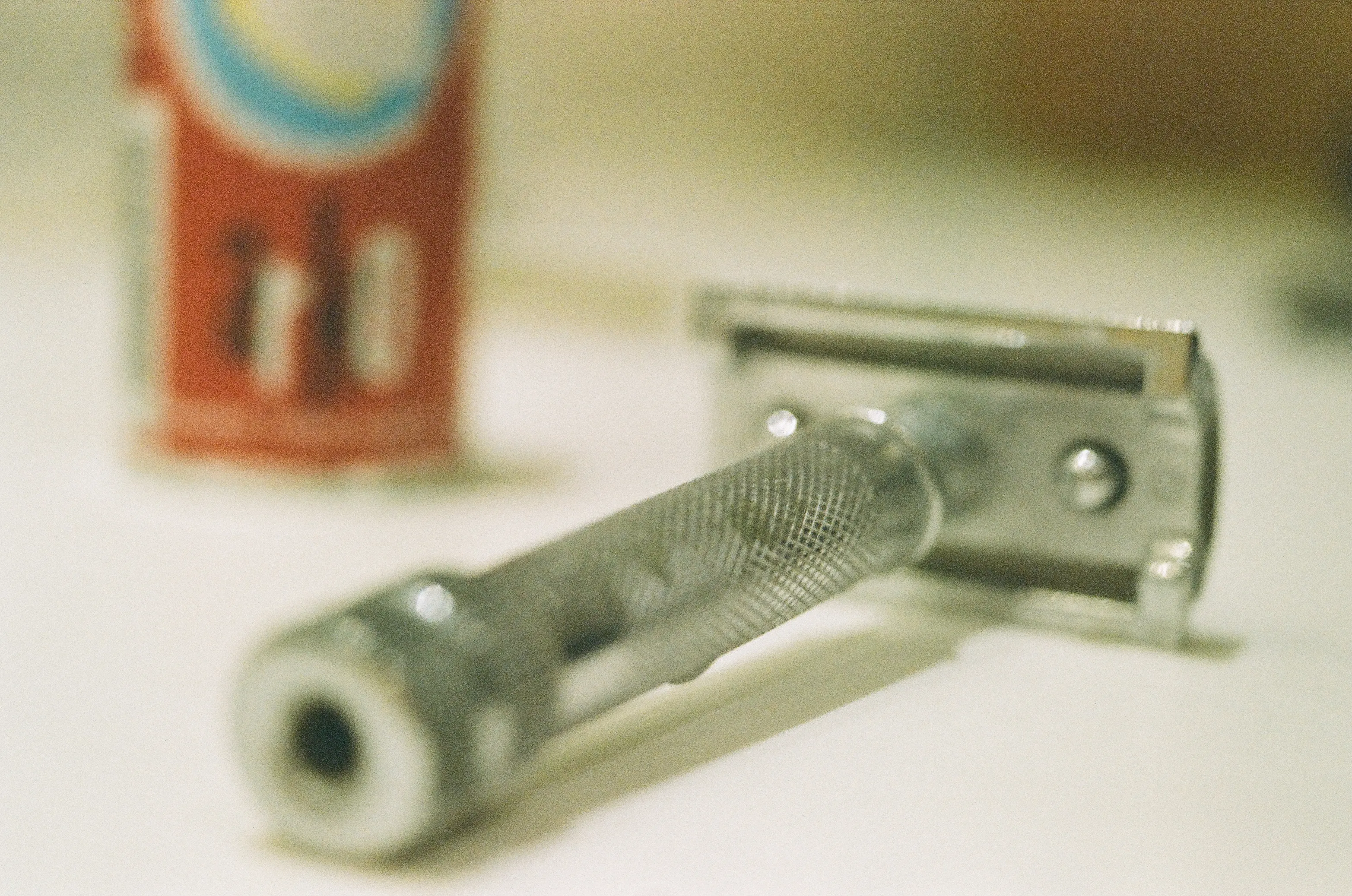 An analog photo I took of my razor. Pentax K2, Macro lens, Expired Gold 200
